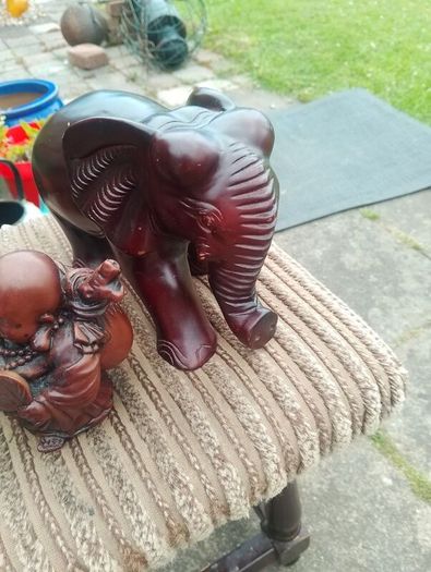 carved wooden elephant and 2 Buddha
