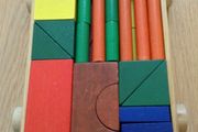 Colourful Wooden shapes construction game in wooden trolley