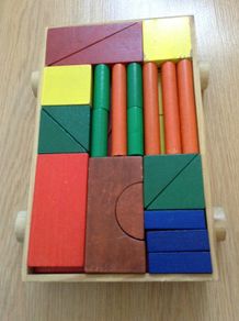 Colourful Wooden shapes construction game in wooden trolley