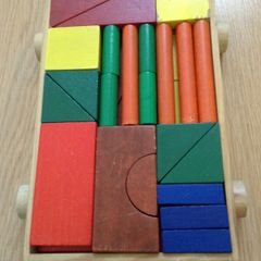 Colourful Wooden shapes construction game in wooden trolley