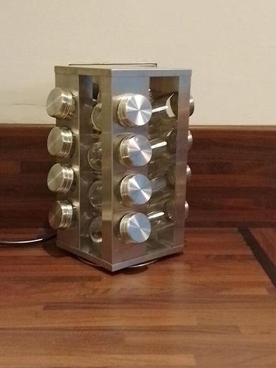 Rotating spice rack with 16 glass jars