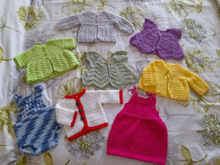 Handmade baby cardigans and dresses from newborn