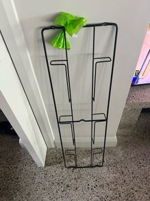 Stylish wall mounted black metal magazine rack