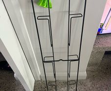 Stylish wall mounted black metal magazine rack