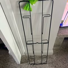 Stylish wall mounted black metal magazine rack