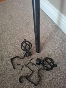 Black metal extendable curtain pole
