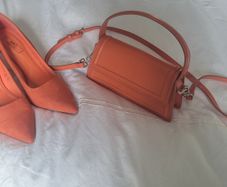 Matching orange shoes and bag