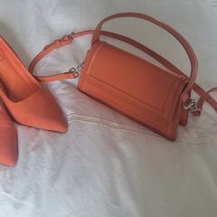 Matching orange shoes and bag