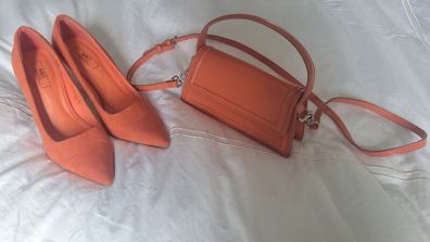 Matching orange shoes and bag