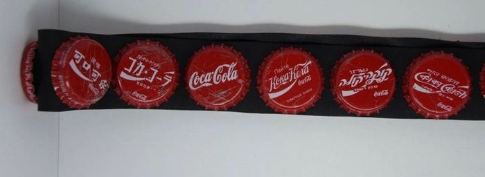 Coca Cola belt with cola caps from all over the world