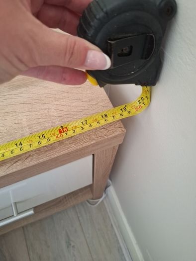 Timer and white wardrobe and bedside locker