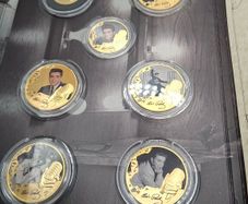 Elvis Presley coins including 9ct gold one weight 8 grams