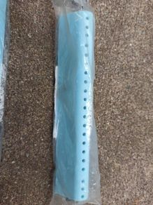 Washing machine drum lifter