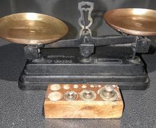 Antique cast iron and brass 5kg scales with 3 weights