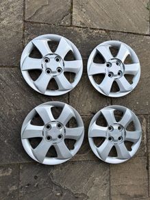 Four Plastic Silver Hub Caps