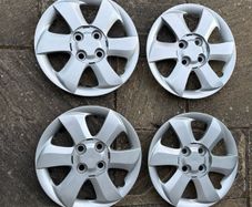 Four Plastic Silver Hub Caps