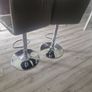 2 grey leather look swivel bar stools Image 4