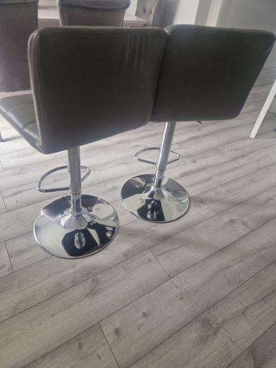 2 grey leather look swivel bar stools