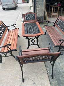 Raised beds bird feeders and cast iron benches
