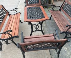 Raised beds bird feeders and cast iron benches