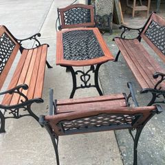 Raised beds bird feeders and cast iron benches