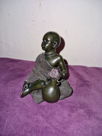 African child with water jug statue
