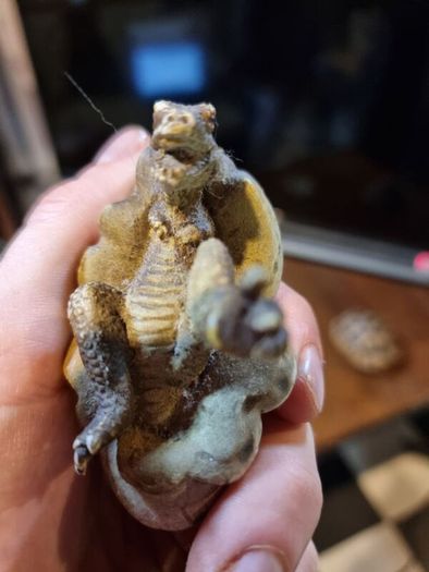 Hatching dinosaur toy figurine