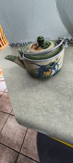 3 different items. No. 1- Mid-Century Porcelain Teapots, Japan, 1960.  95.00 euro. 2- VTG Hand Painted Le Poet Laval France Serving Plate 22.00 euro. 3- Vintage Short Dark Forest Green Ceramic 22.00 euro.