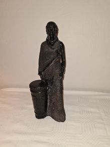 African woman with drum statue