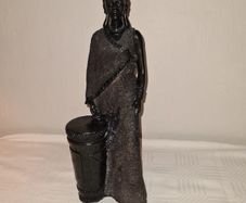 African woman with drum statue