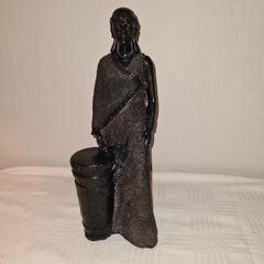 African woman with drum statue