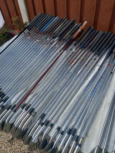 A selection of Golf clubs. Bags and golf balls.