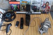 Nintendo Wii with steering wheel, HDMI adapter, 4 games