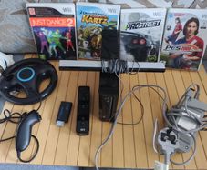 Nintendo Wii with steering wheel, HDMI adapter, 4 games