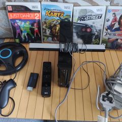 Nintendo Wii with steering wheel, HDMI adapter, 4 games