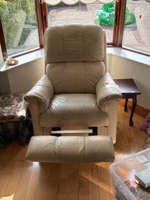 Matching cream two-seater sofa and reclining armchair