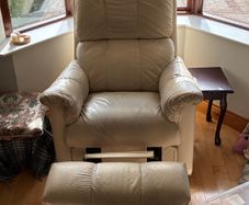 Matching cream two-seater sofa and reclining armchair