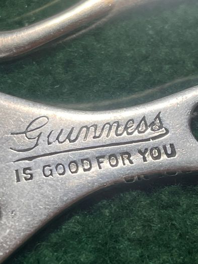 pair of vintage Guinness Bottle Openers