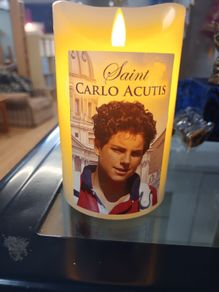 carlo acutis candle,battery operated,with prayer on the back,vanilla scented,comes in  a box.