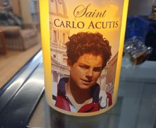 carlo acutis candle,battery operated,with prayer on the back,vanilla scented,comes in  a box.