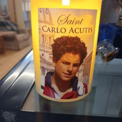 carlo acutis candle,battery operated,with prayer on the back,vanilla scented,comes in  a box.