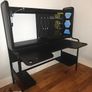 Black gaming desk with integrated pegboard and shelf Image 4