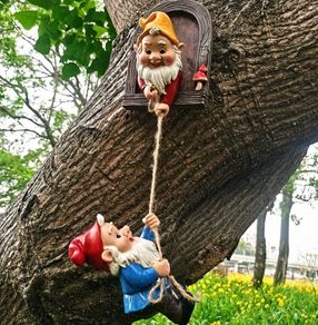 Gnome climbing statues for tree