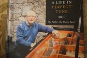 A Life In Perfect Tune. My Father The Piano Tuner. By Anthony Woods. Signed First Edition Large Volume Hardback In Very Good Condition.