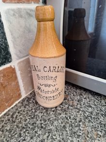 Vintage Neal Carlin stoneware beer bottle