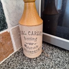 Vintage Neal Carlin stoneware beer bottle