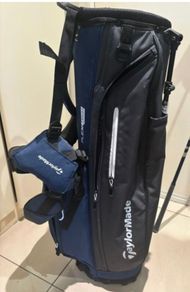 NEW - TaylorMade FlexTech Stand Bag (Black/Blue), stand legs still have the factory wrapping on them.