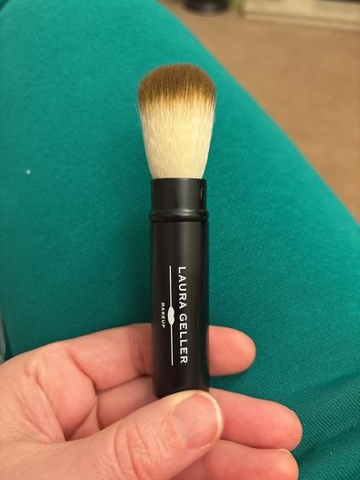 Retractable baked powder brush