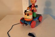 Wooden pull along drumming toy