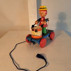 Wooden pull along drumming toy